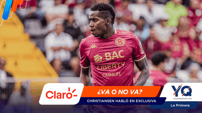 Soccer player in a maroon kit on the pitch, with a colorful news banner across the bottom reading '¿VA O NO VA? Christiansen habló en exclusiva' and logos Claro and YQ in view.