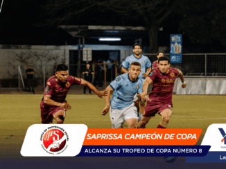 Soccer players in blue and maroon chase the ball on a night-time field while a bright banner at the bottom reads 'SAPRISSA CAMPEÓN DE COPA' with logos on left and right.