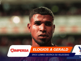 Close-up portrait of a male footballer with a serious expression, blurred stadium background and bold article banners across the lower portion of the image.