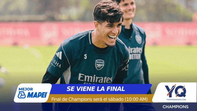 Arsenal player laughing during training in teal kit; foreground banner says 'SE VIENE LA FINAL' with sponsor logos.