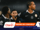 Soccer players celebrate on the field with sponsor banners at the bottom of the screen (Claro, YQ logos).