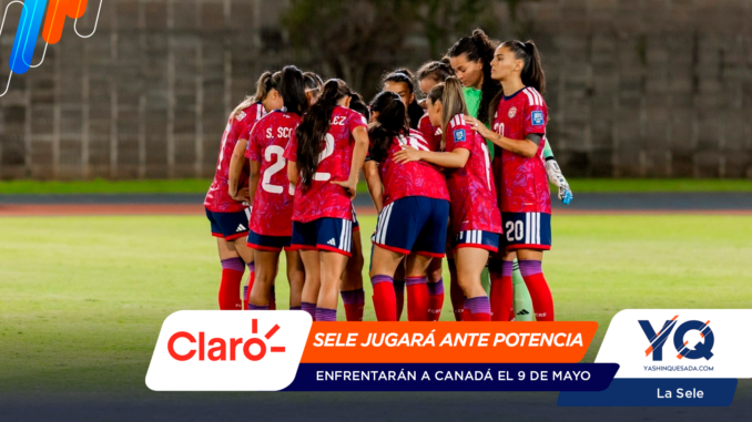 Women's soccer team huddled together in red uniforms on a grassy field before a match, showing teamwork and unity.
