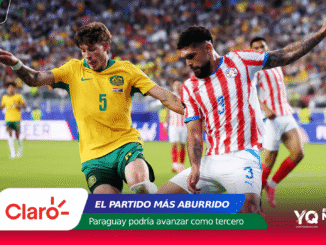 Two soccer players compete for the ball in a crowded stadium, with colorful banners and Claro/Mundial 2026 branding along the bottom of the image.