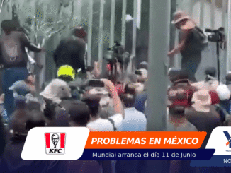Crowd of people on a street with a camera operator filming; on-screen banner reads 'PROBLEMAS EN MÉXICO' in orange and white graphics.