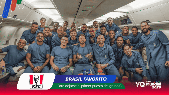 Group of athletes in matching blue outfits posing together inside an airplane cabin, smiling at the camera.