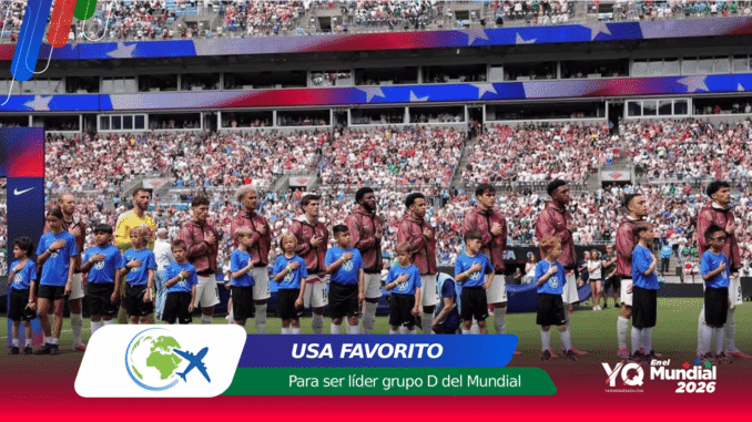 Soccer players stand in a line with hands over their chests during the national anthem in a full stadium, with USA FAVORITO and Mundial 2026 banners visible.