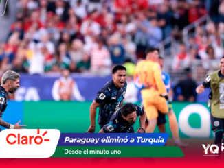 Soccer players celebrate on the field as fans cheer in the stands, with Claro branding at the bottom edge.