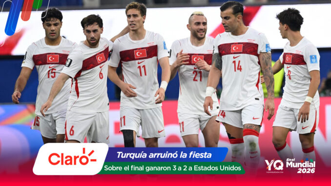 Turkish national football players celebrate on the field after a win, wearing white kits with red flags, with colorful sponsor banners in the foreground (Claro, Mundial 2026).