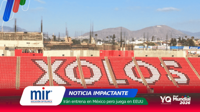 Wide view of a stadium with red seating forming a white mosaic, a construction site and distant hills under a blue sky; a colorful news banner overlays the bottom edge with logos and text.