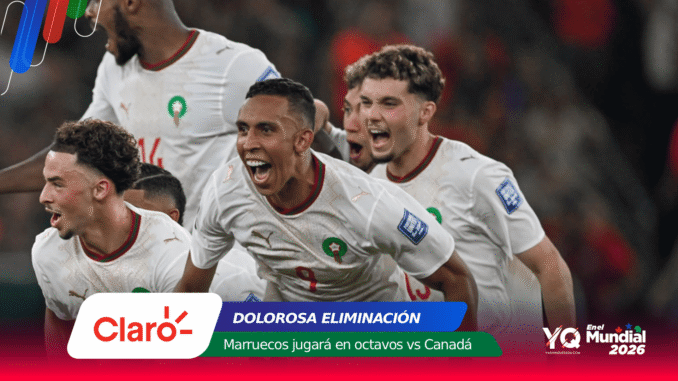 Morocco national football team players in white kits celebrate on the pitch, faces joyful and shouting.