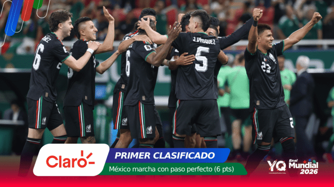 Mexico national soccer team players celebrate together on the field, hugging and cheering after a goal or win, in black kits with green red accents.