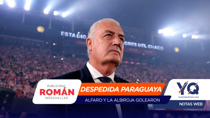 Man in a suit at a packed stadium during a farewell event; foreground banner reads 'Despedida Paraguaya' with crowd in the background.