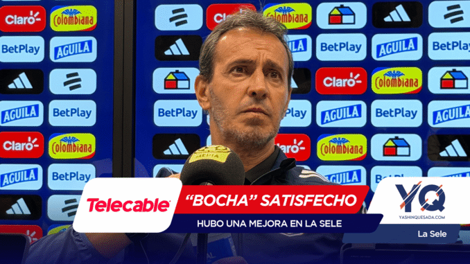 Man speaks at a press conference with a backdrop full of sponsor logos (Claro, BetPlay, Aguila, Colombiana) and a Telecable microphone in front.