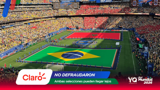 Bird's-eye view of a packed stadium with a large Brazilian flag on the field and teams lined up for a ceremony amidst colorful stands and banners.
