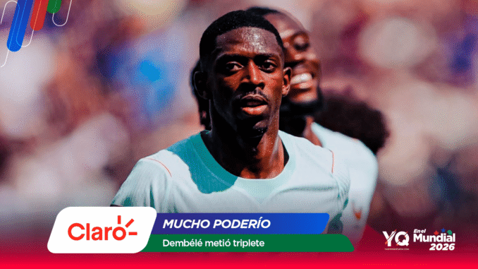 Soccer player in a light turquoise jersey running on a blurred stadium field with colorful sponsor graphics at the bottom edge.