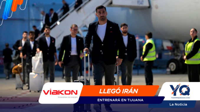 Men in suits walking through an airport tarmac, leading luggage carts; security staff in neon vests in background.
