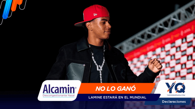 Male performer in a red cap on a dark stage, with sponsor banners reading 'Alcamín' and 'NO LO GANÓ' in the foreground.