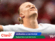 Soccer player celebrating with arms outstretched and head tilted back, overlapping colorful banner graphics at the bottom indicating a match highlight.