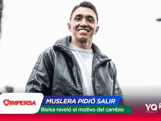 Smiling man in a gray jacket outdoors; colorful graphic banner overlays a sports news banner at the bottom.