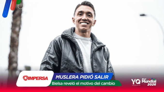 Smiling man in a gray jacket outdoors; colorful graphic banner overlays a sports news banner at the bottom.
