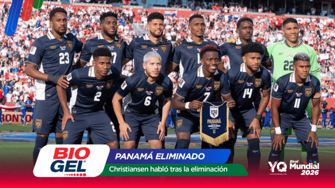 Panama national football team posing for a group photo on the field after a match, players in navy uniforms with crest, crowd in background, banner reads 'Panamá Eliminado'