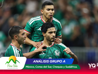 Three Mexican national team players celebrate on the soccer field in green jerseys, crowd blurred in the background.