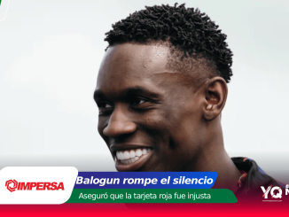 Close-up of a smiling Black man with a light background and colorful banner graphics at the bottom edge.