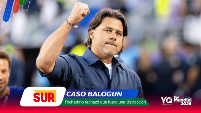 Politician raising his fist at a rally with campaign banners and a SUR logo in the foreground (Spanish banner reads 'Caso Balogún').