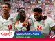 Three England footballers celebrate with arms around each other on the pitch as a crowded stadium cheers behind them; Claro logo and 'Mundial 2016' graphic overlay at bottom left.