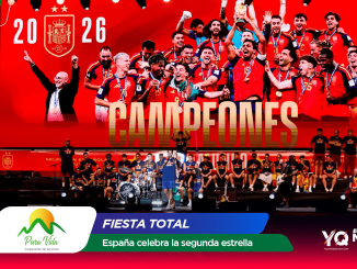 Athletes in red uniforms celebrate on a stage with a giant red screen behind them displaying 'CAMPEONES'.