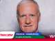 Portrait of a man on a promotional banner with Telecable logo and France–Morocco match text.