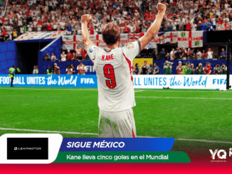 England forward Kane (No. 9) celebrates with fists raised on a green pitch as a packed stadium cheers behind him at the World Cup 2026.