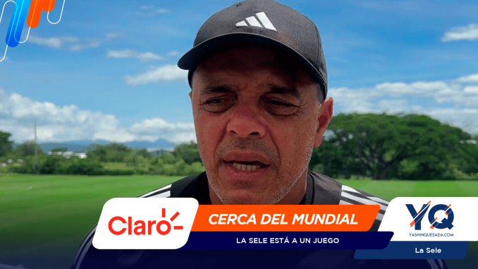 Close-up portrait of a man in a dark cap outdoors, with a bright promotional banner at the bottom showing Claro and Yashinquesada branding.