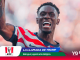 Soccer player Balogun celebrates with arm raised, overlaid with KFC logo and bold text about Belgium and Mundial 2026.