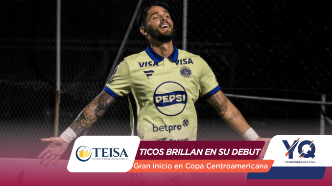 Soccer player in a pale yellow jersey with Pepsi sponsor, arms spread in celebration on a dark field at night.