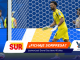 Soccer goalkeeper in a bright yellow kit stands in front of the goal with white gloves, blue stadium backdrop and ad banners at the bottom.