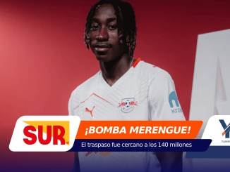 Soccer player in a white RB Leipzig jersey stands against a red studio backdrop with bold overlapping sponsor graphics in orange, blue, and white.
