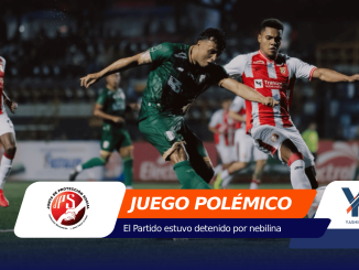Soccer match action: two players in green and red-white kits contest the ball on the field with an orange banner that reads 'JUEGO POLÉMICO' in the foreground.