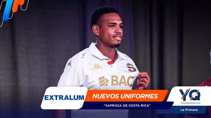 Young man in a white sports jersey speaking on stage with colorful overlay graphics around him.